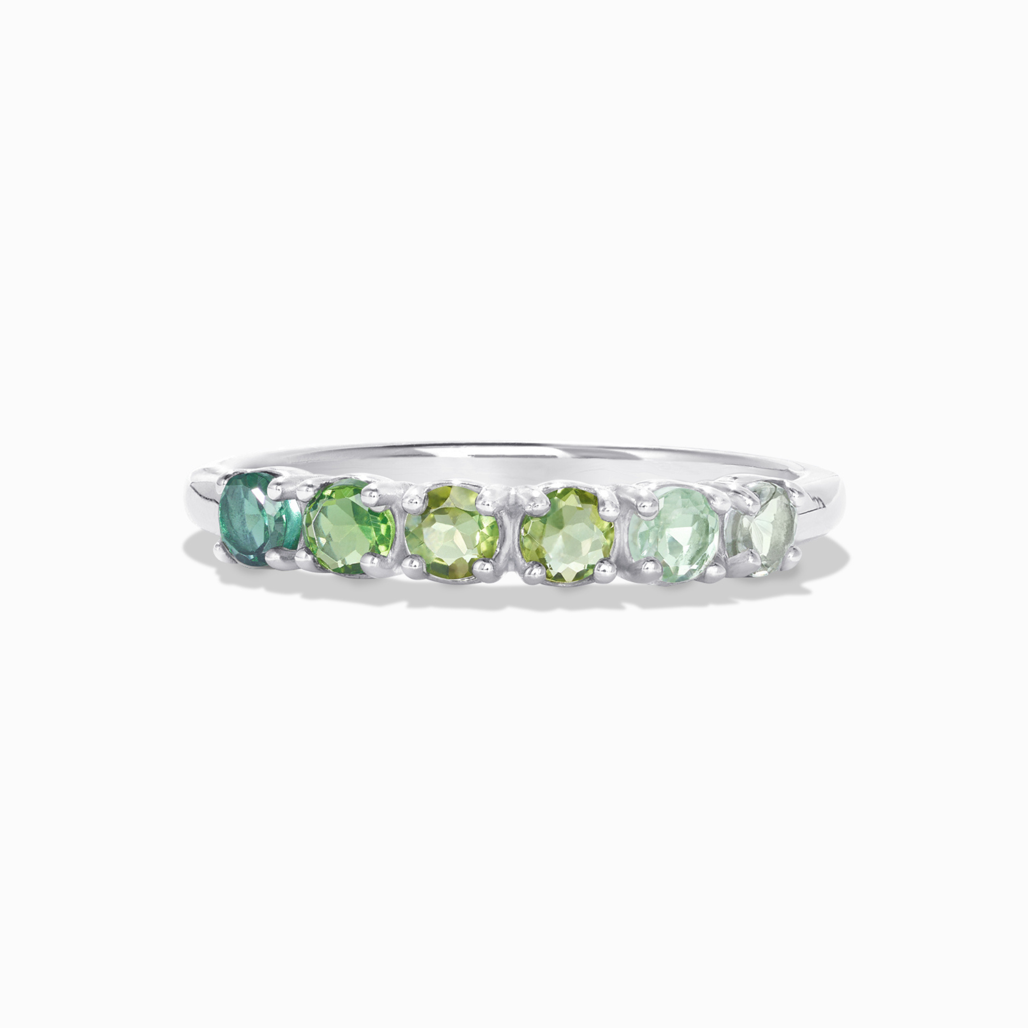 Ombre green tourmaline eternity band in sterling silver on white background