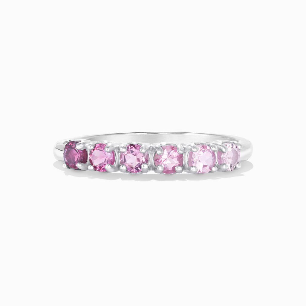 Ombre pink tourmaline eternity band in sterling silver on white background