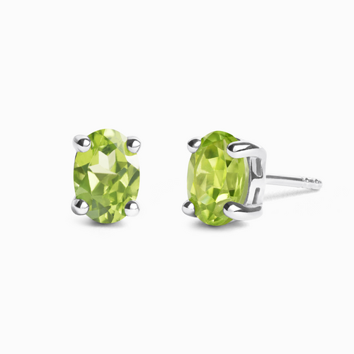 Peridot oval stud earrings in sterling silver on white background
