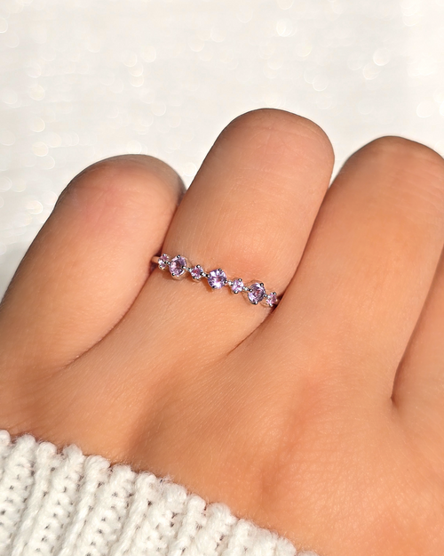 Vianne Jewellery pink sapphire and lavender amethyst eternity band in sterling silver worn on hand