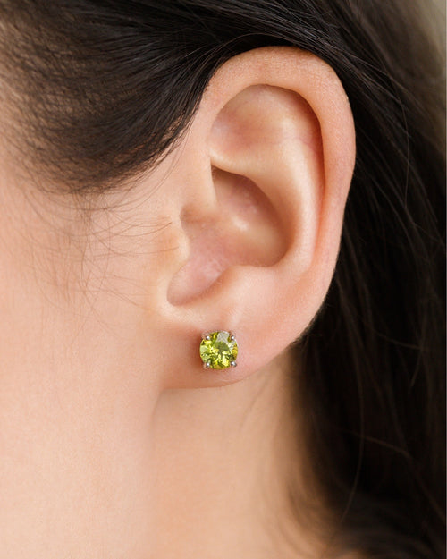 Peridot round stud earrings in sterling silver model image