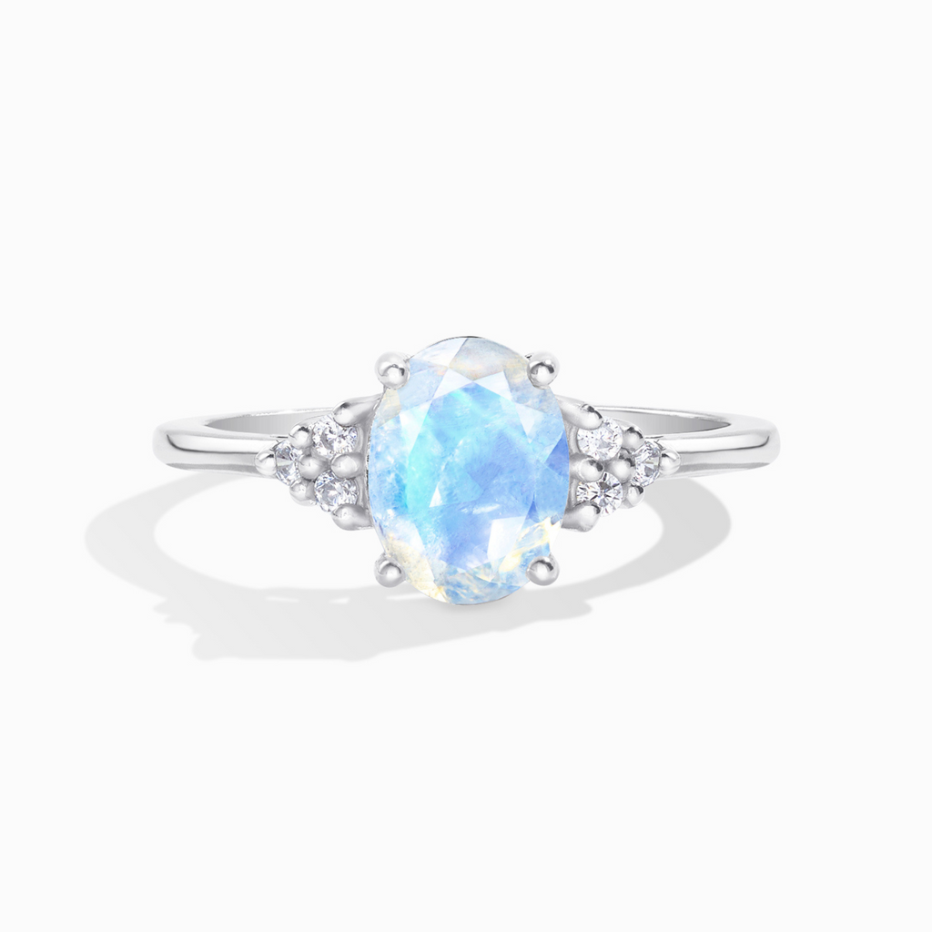 Rainbow moonstone oval cut ring in sterling silver on white background