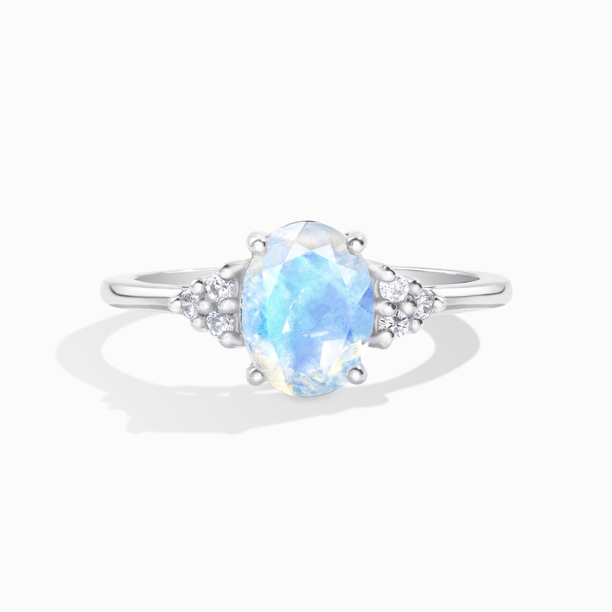 Rainbow moonstone oval cut ring in sterling silver on white background