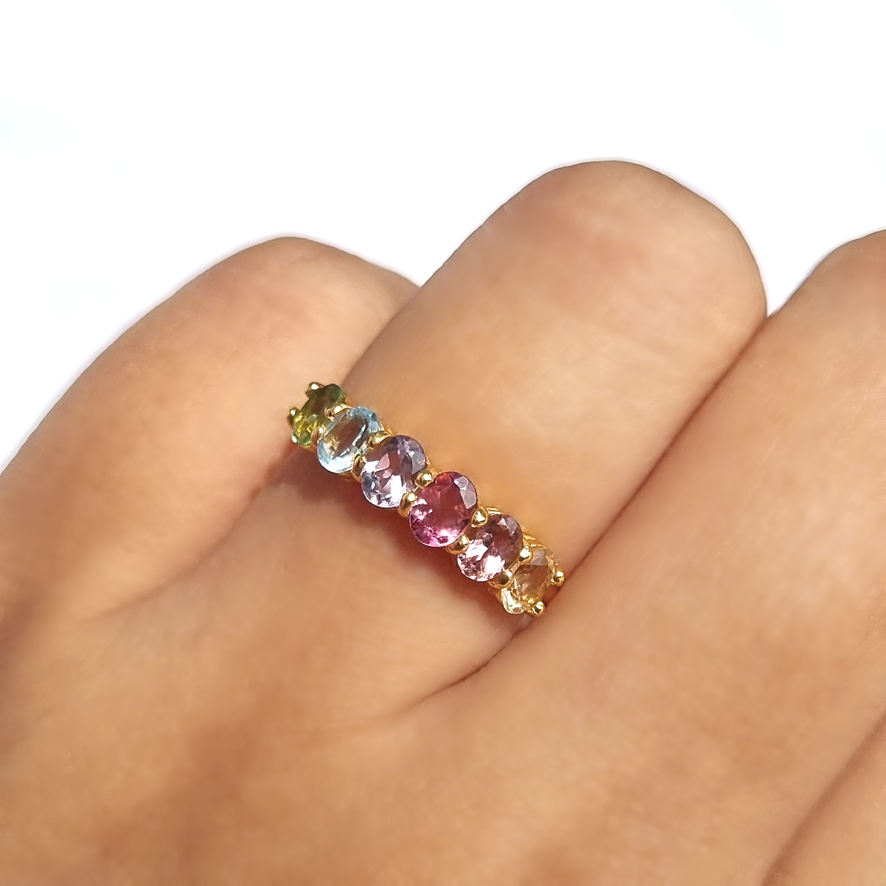 Rainbow multicoloured gemstone half eternity ring in 18k gold vermeil on hand