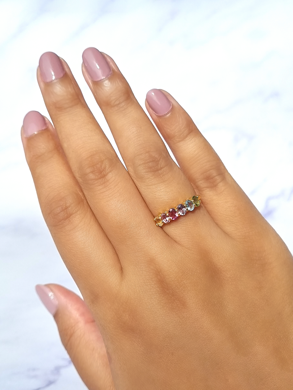 Rainbow multicoloured gemstone half eternity ring in 18k gold vermeil on hand detail image