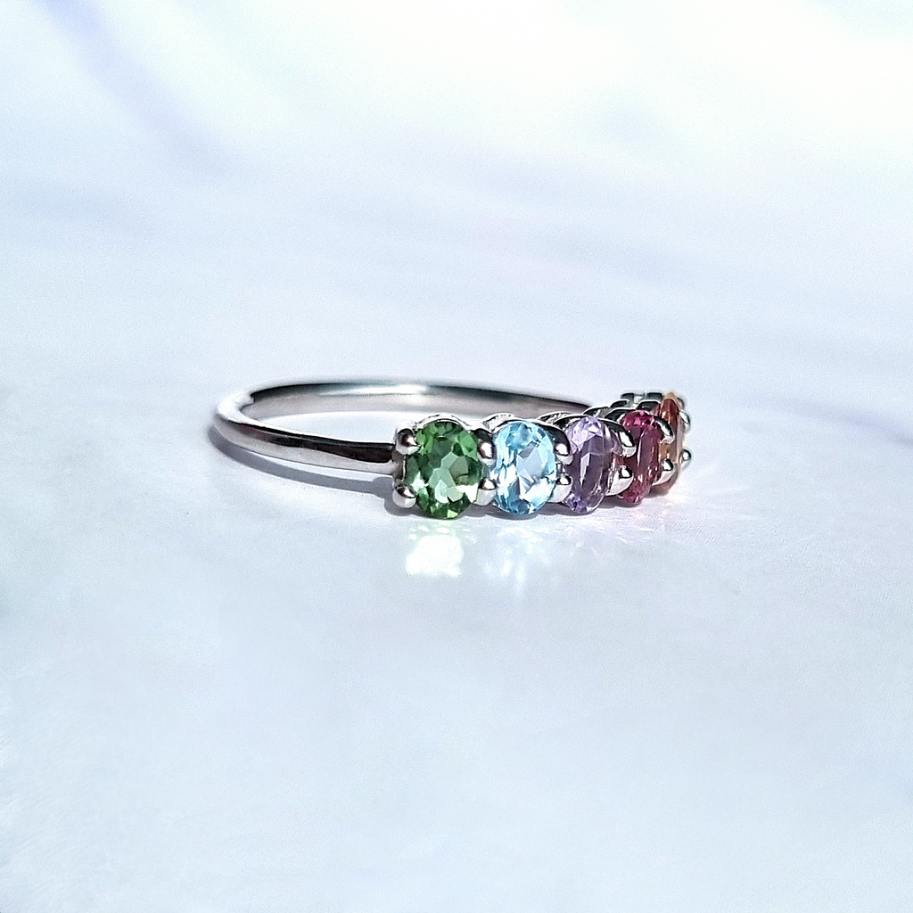 Rainbow multicoloured gemstone half eternity ring in sterling silver side view