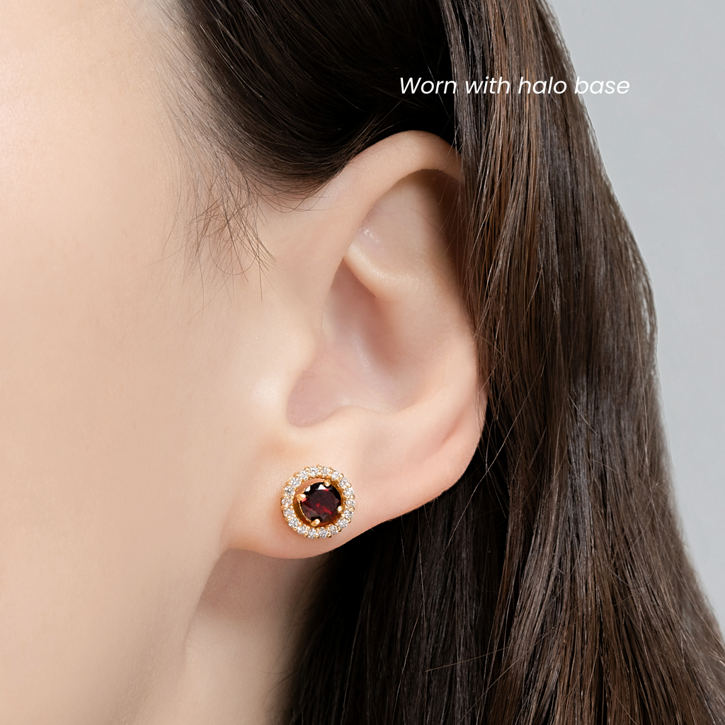 Model wearing red garnet halo stud earrings in 18k gold vermeil