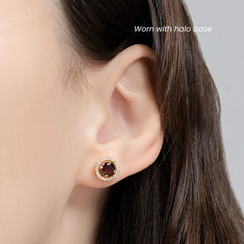 Model wearing red garnet halo stud earrings in 18k gold vermeil