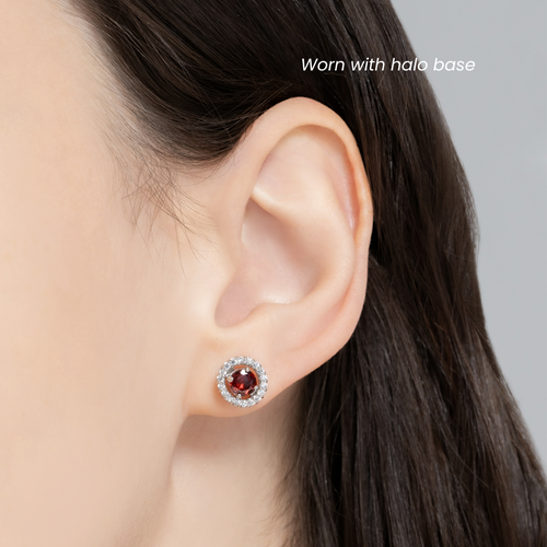 Garnet halo stud earrings with jackets in sterling silver on model