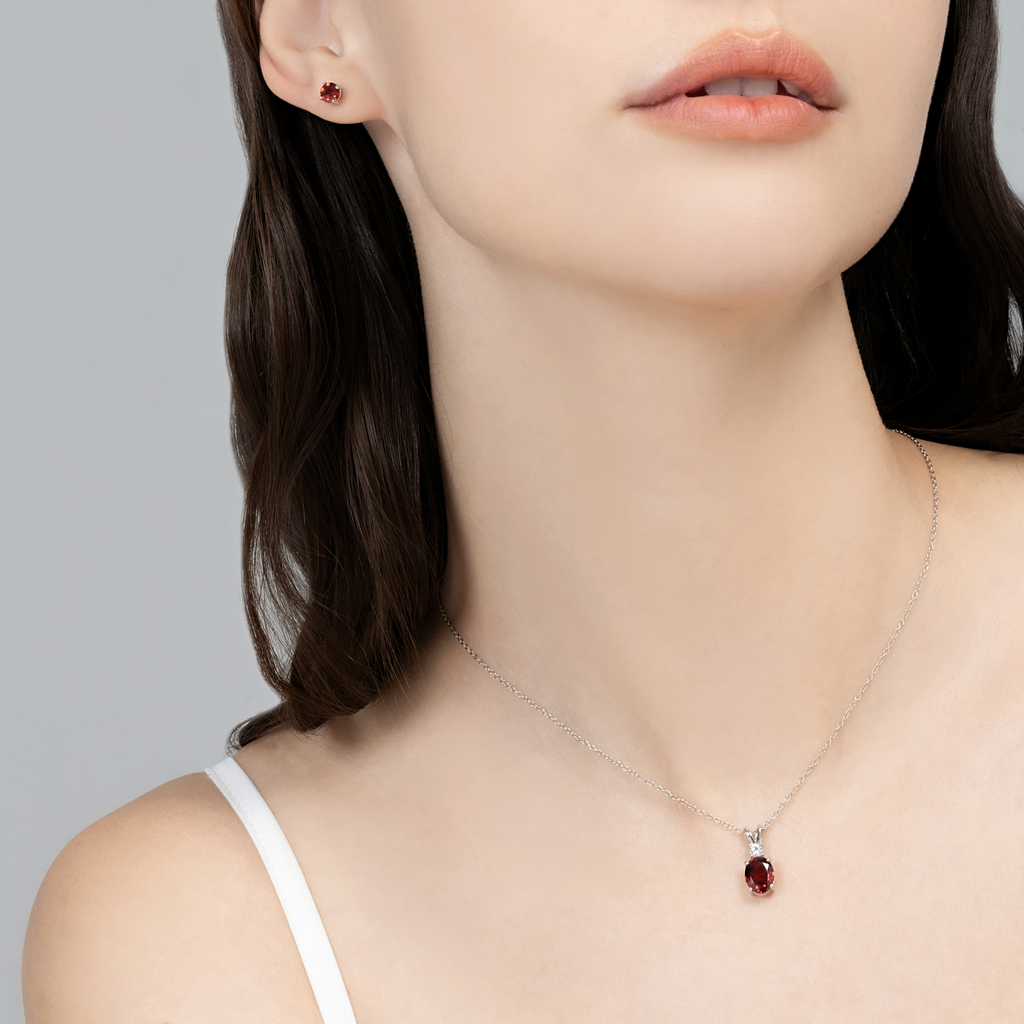 Model wearing red garnet pendant necklace in sterling silver