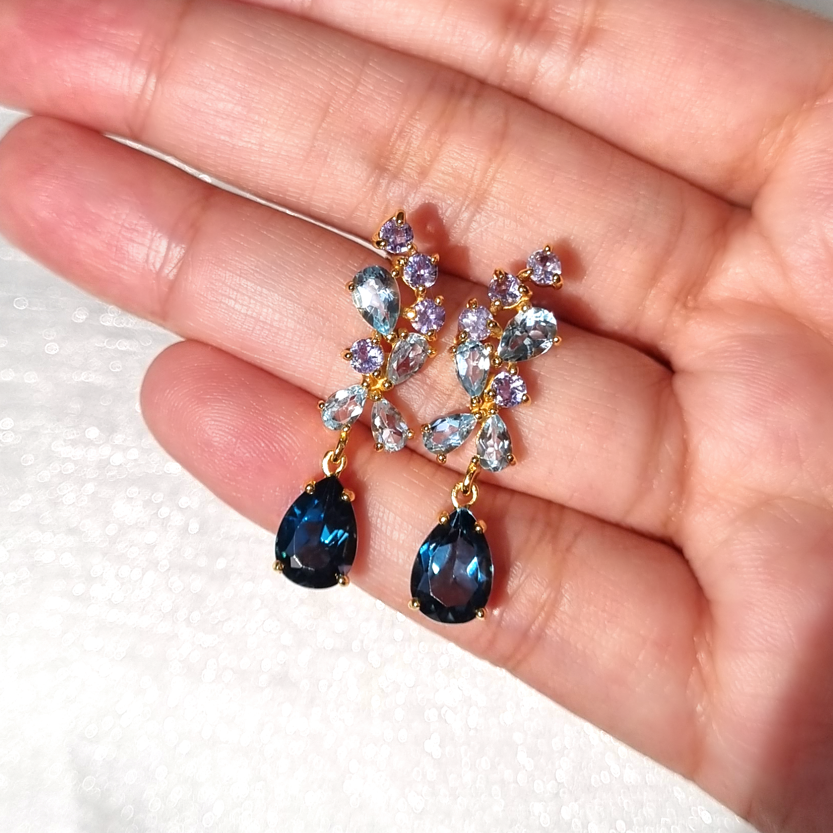 Blue gemstone drop earrings in 18k gold vermeil detail lifestyle image