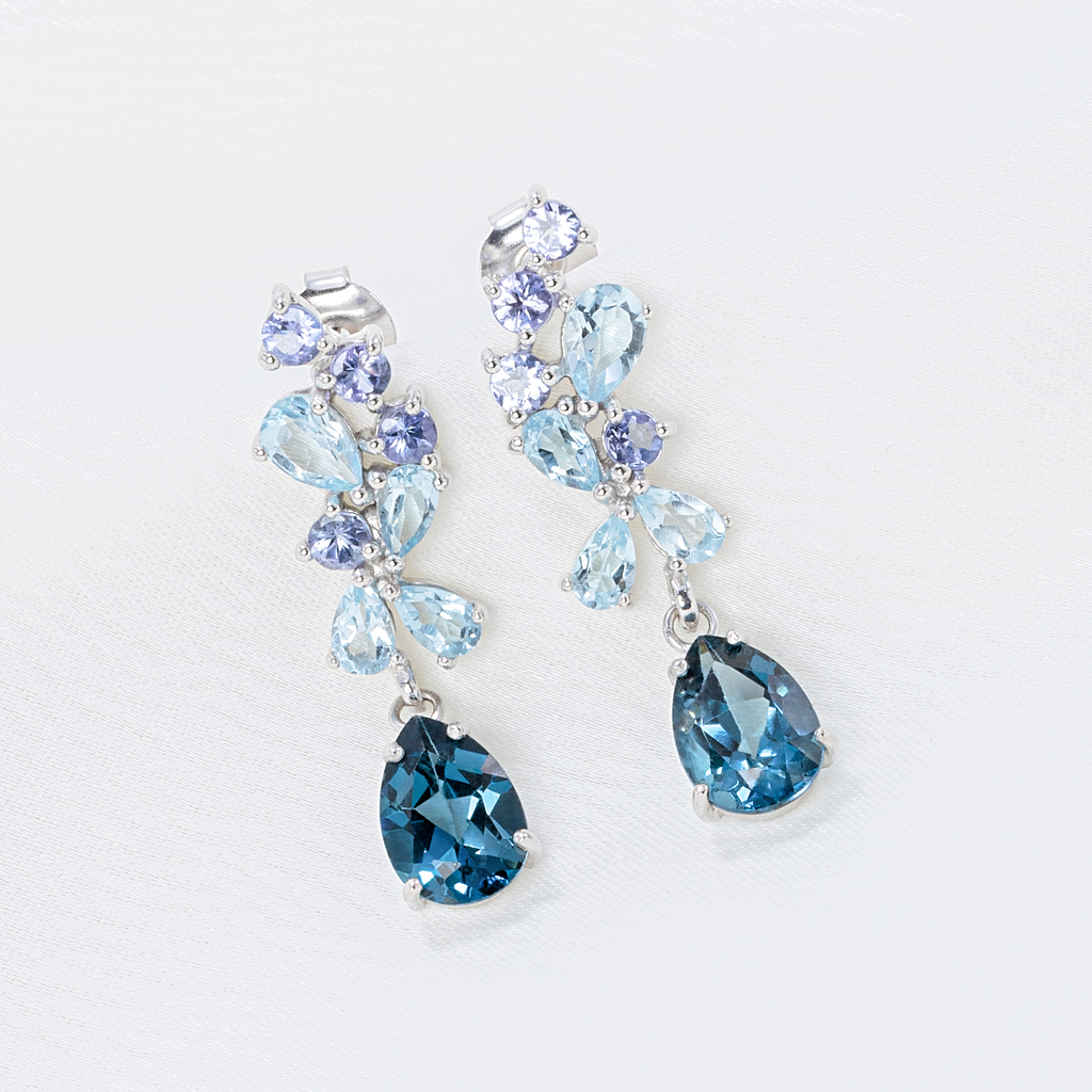 Blue gemstone drop earrings in sterling silver detail lifestyle image