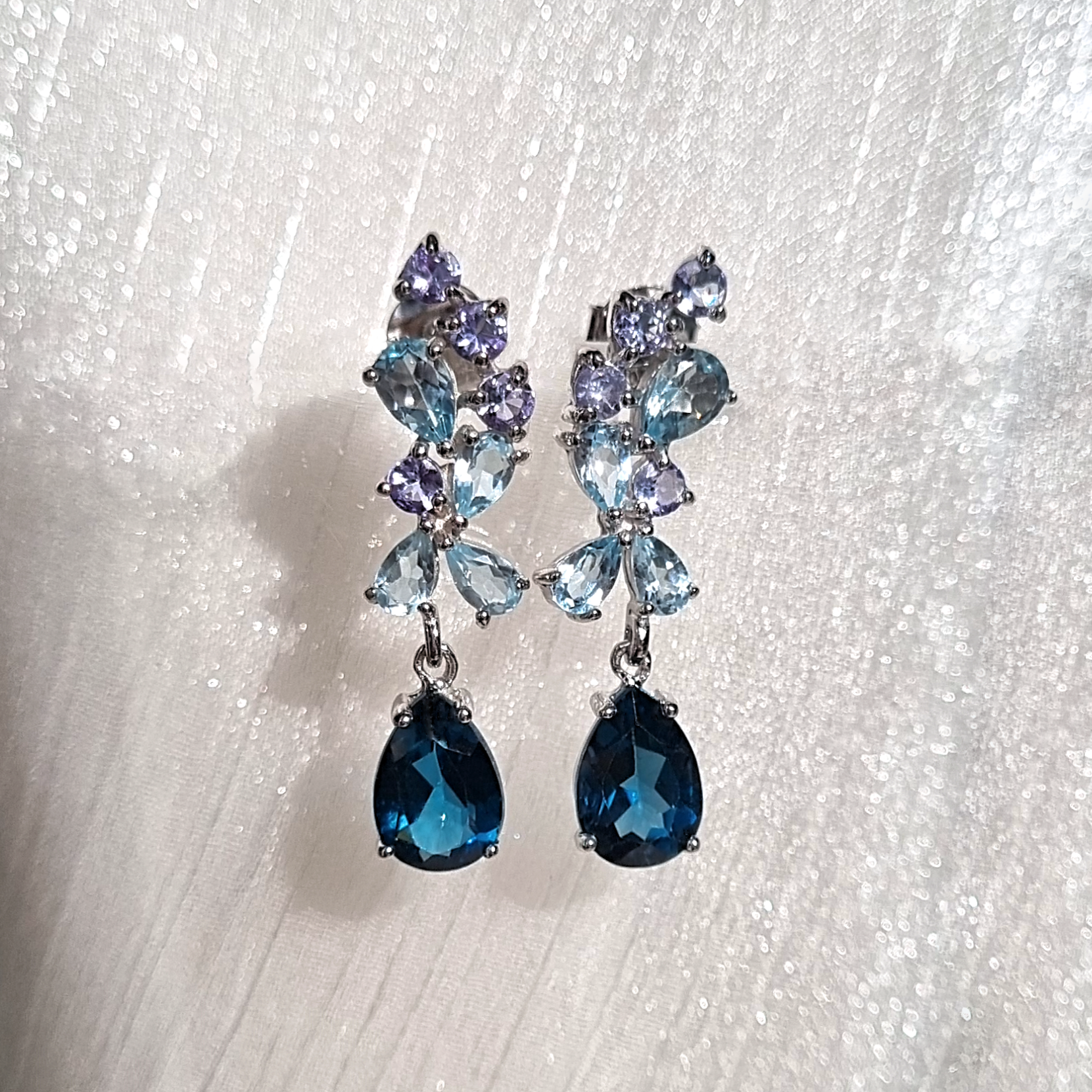 Blue gemstone drop earrings in sterling silver lifestyle image