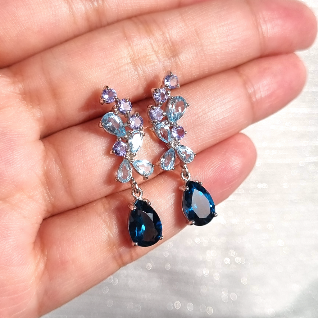 Blue gemstone drop earrings in sterling silver styled image