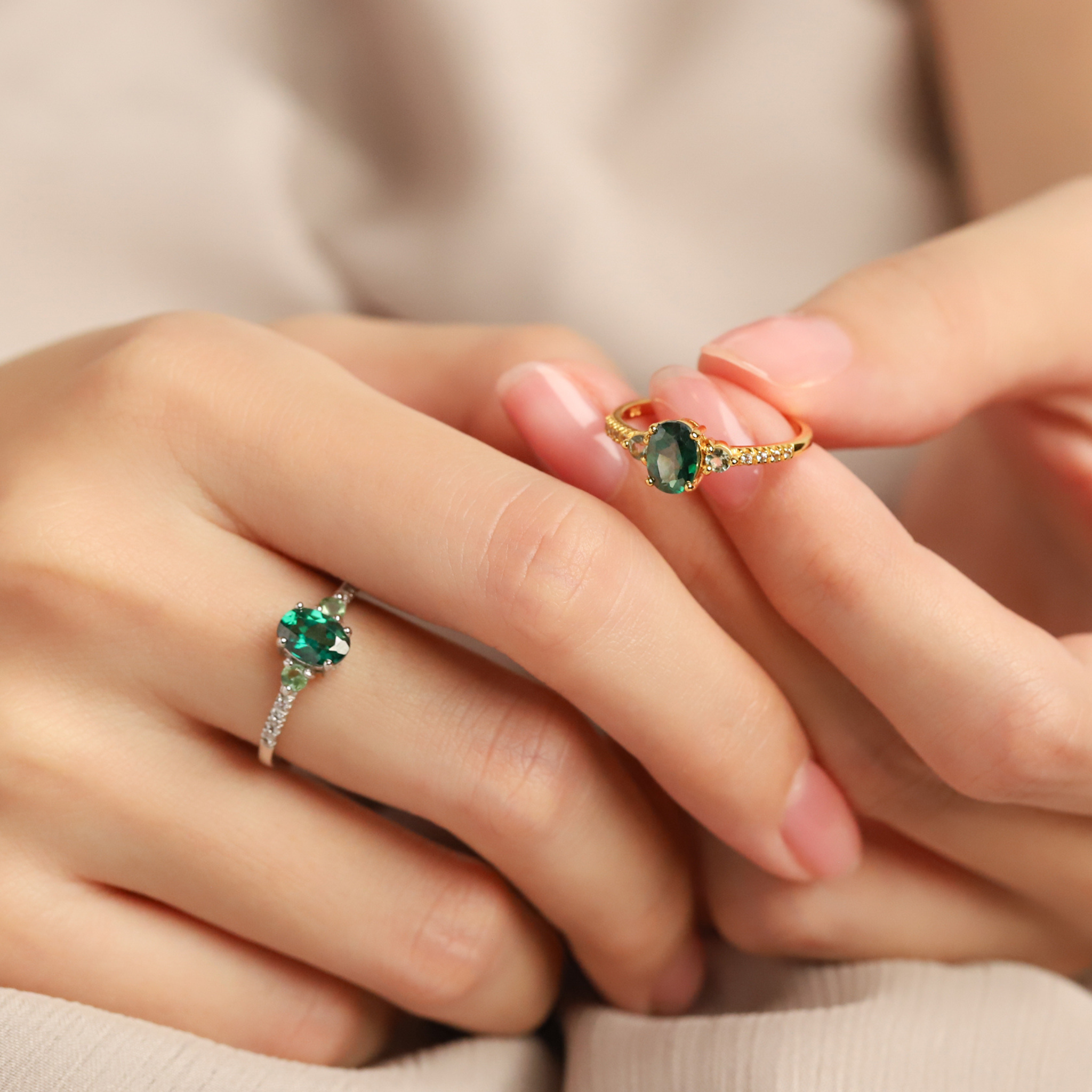 Green topaz and green tourmaline rings in sterling silver and 18k gold vermeil on hand