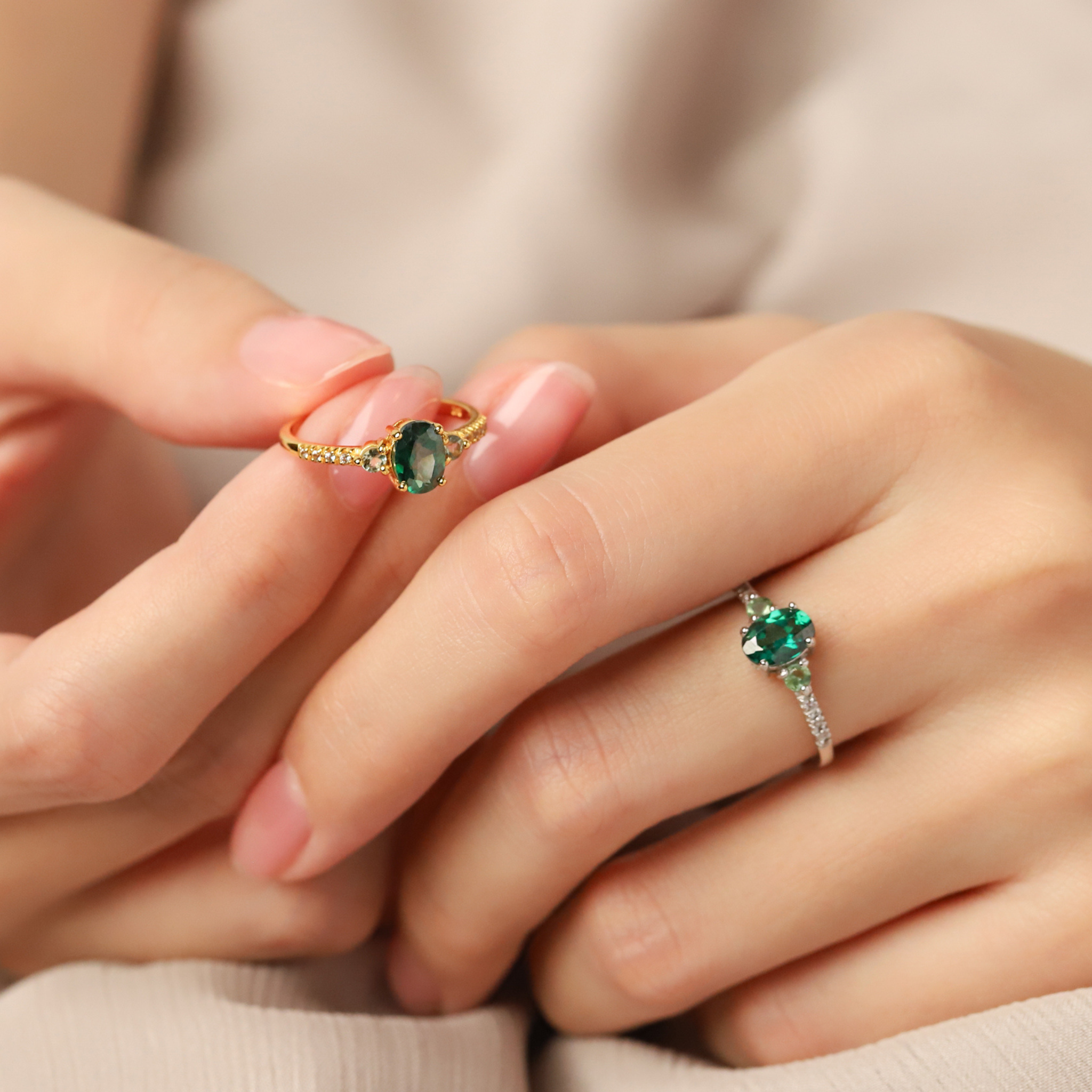 Green topaz and green tourmaline rings in sterling silver and 18k gold vermeil on hand