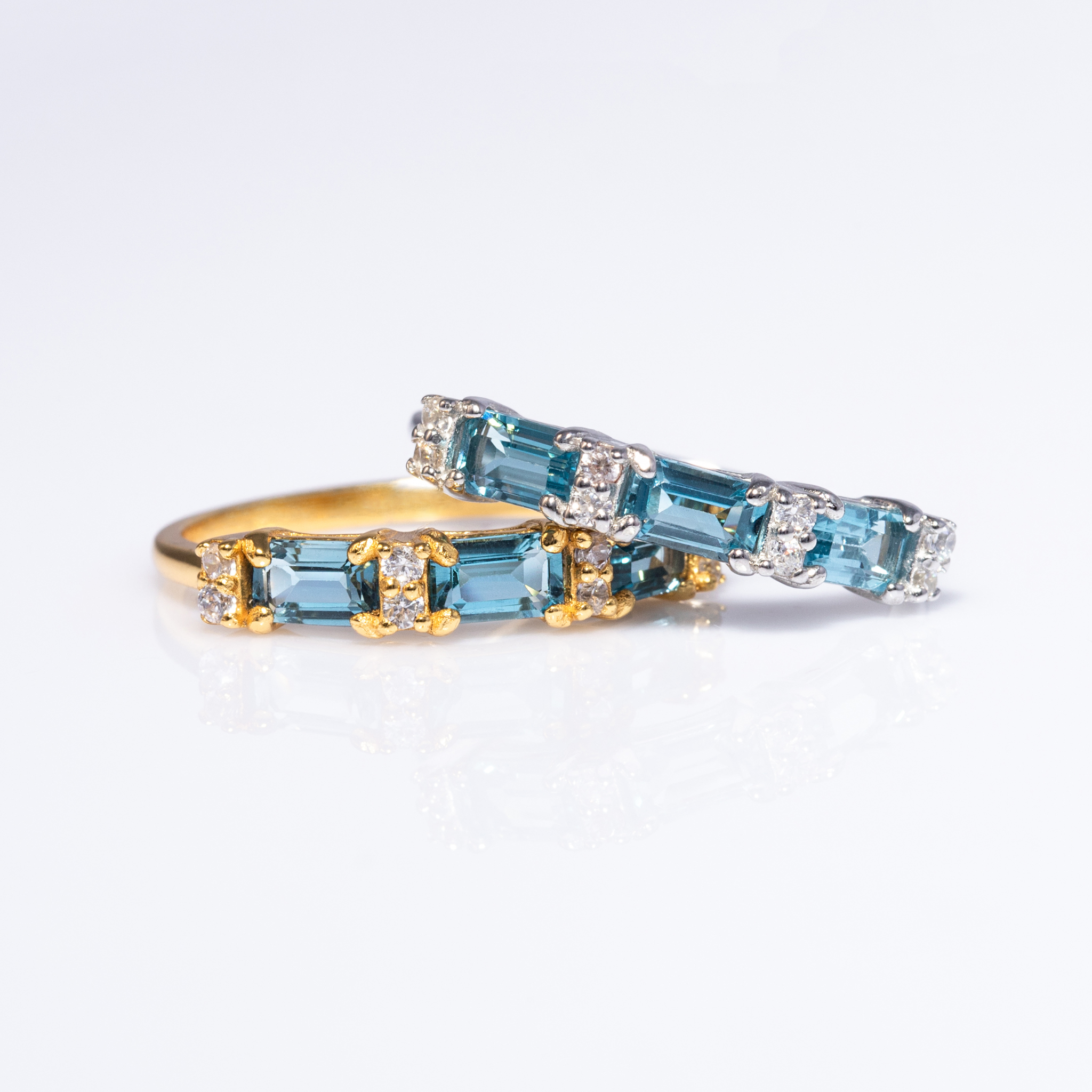 London blue topaz emerald cut eternity rings in sterling silver and 18k gold vermeil group image