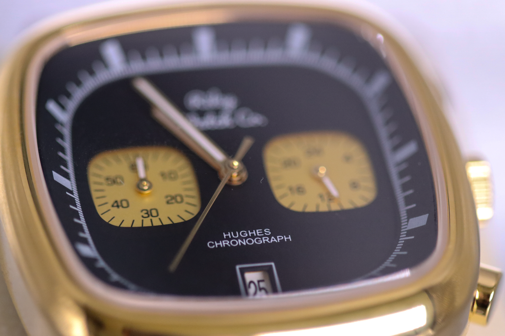 Gold watch case and leather strap detail