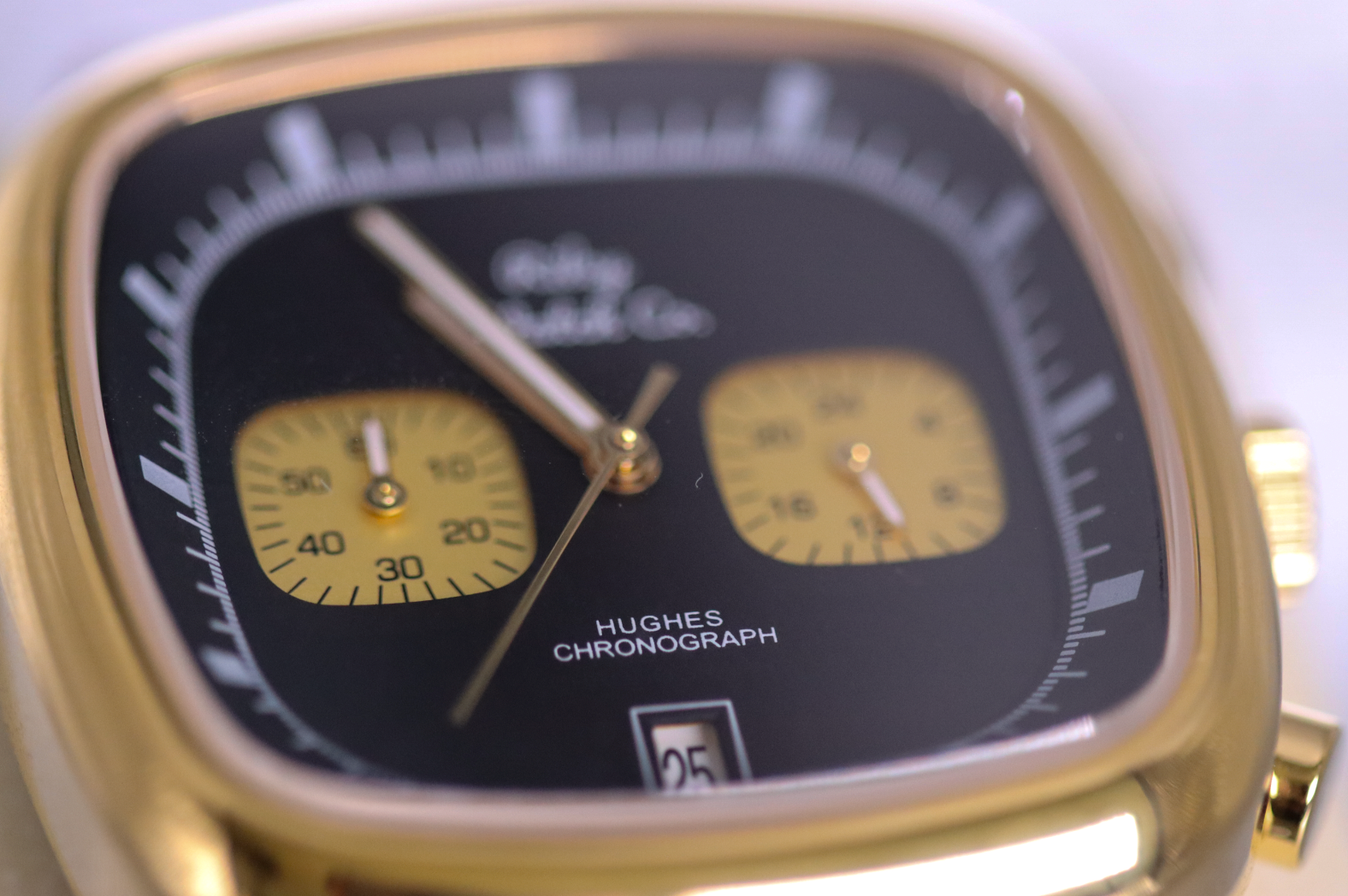 Gold watch case and leather strap detail