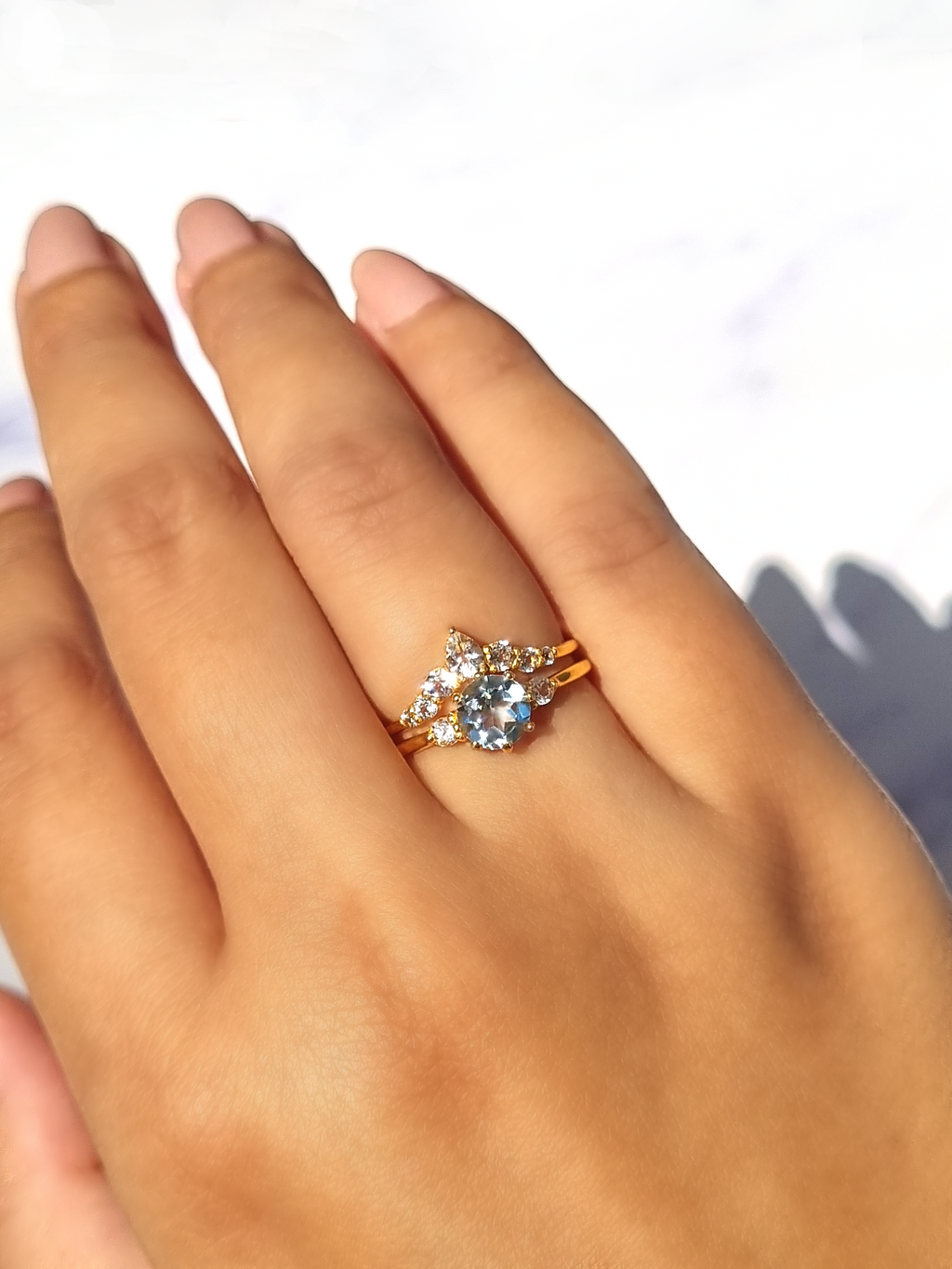 Selene sky blue topaz ring set in 18k gold vermeil on hand detail image