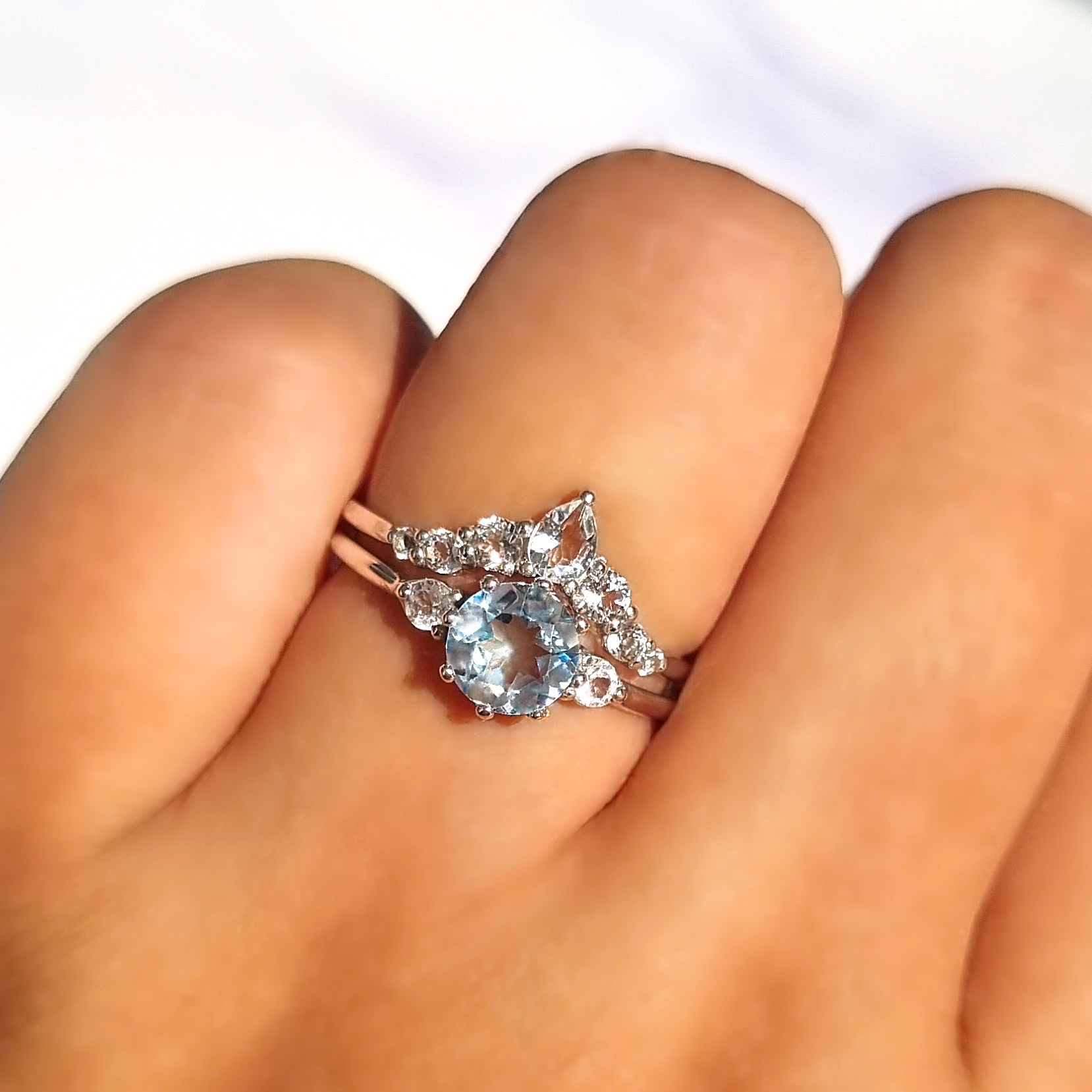 Selene sky blue topaz ring set in sterling silver on hand
