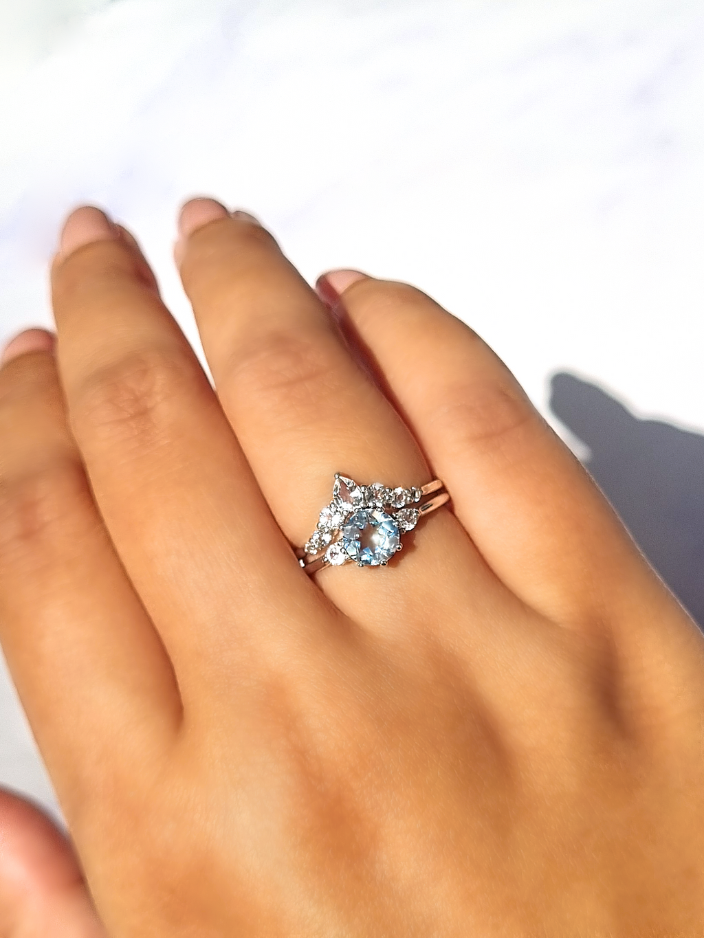 Selene sky blue topaz ring in sterling silver on hand detail image