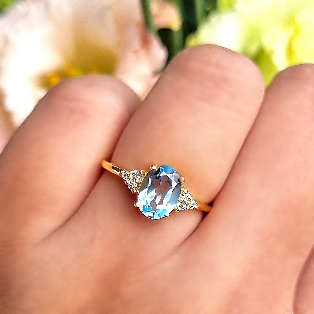 Sky blue topaz oval cut ring in 18k gold vermeil on hand