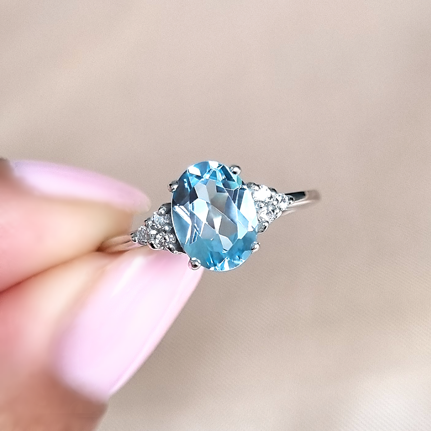 Sky blue topaz oval cut ring in sterling silver lifestyle image