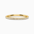 Slim full eternity ring with 1.2mm gold band on white background