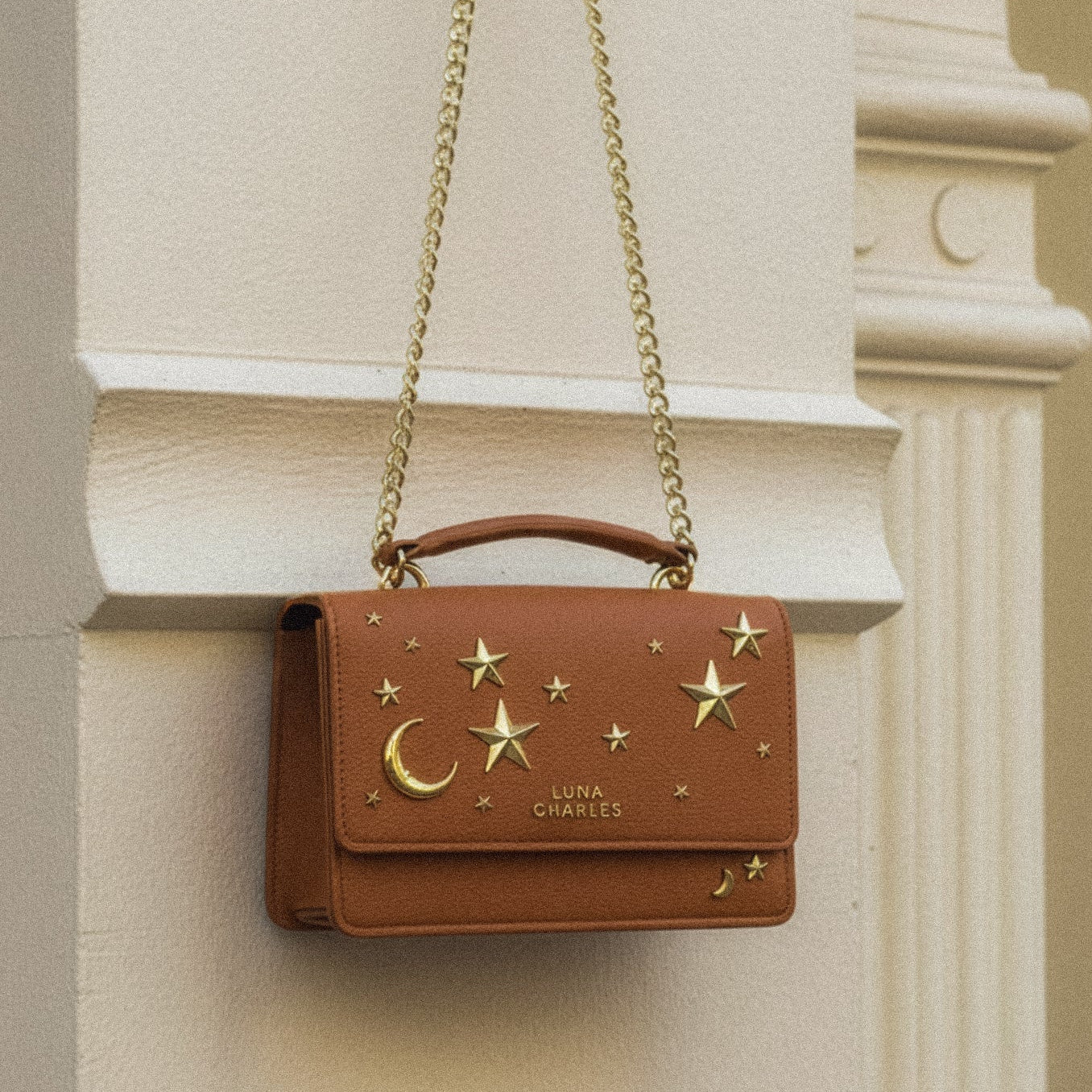 Luna Charles Nova tan and gold crossbody bag close-up detail
