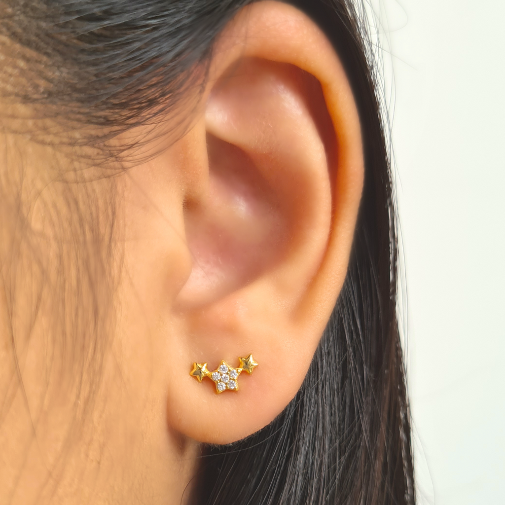 Trio of stars earrings in gold plated sterling silver detail image