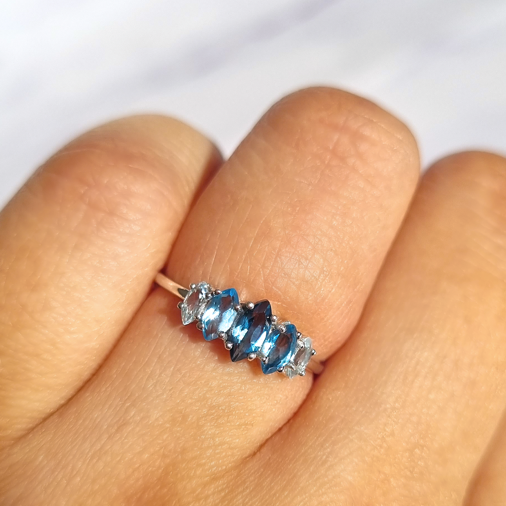 Ombre blue topaz ring in sterling silver on hand