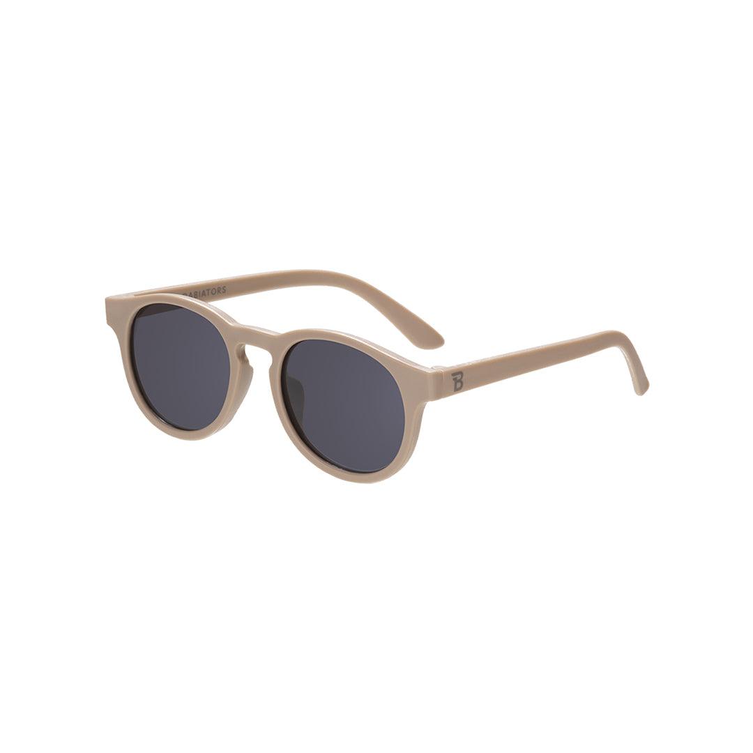 Babiators Eco Original Keyhole kids sunglasses in Soft Sand 0-2 years flat lay