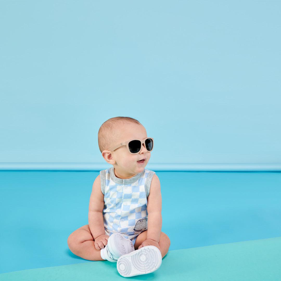 Babiators Eco Original Navigator Soft Sand kids sunglasses worn outdoors