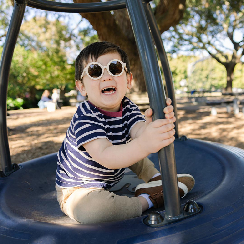 Babiators Original Euro Round Sweet Cream kids sunglasses worn outdoors