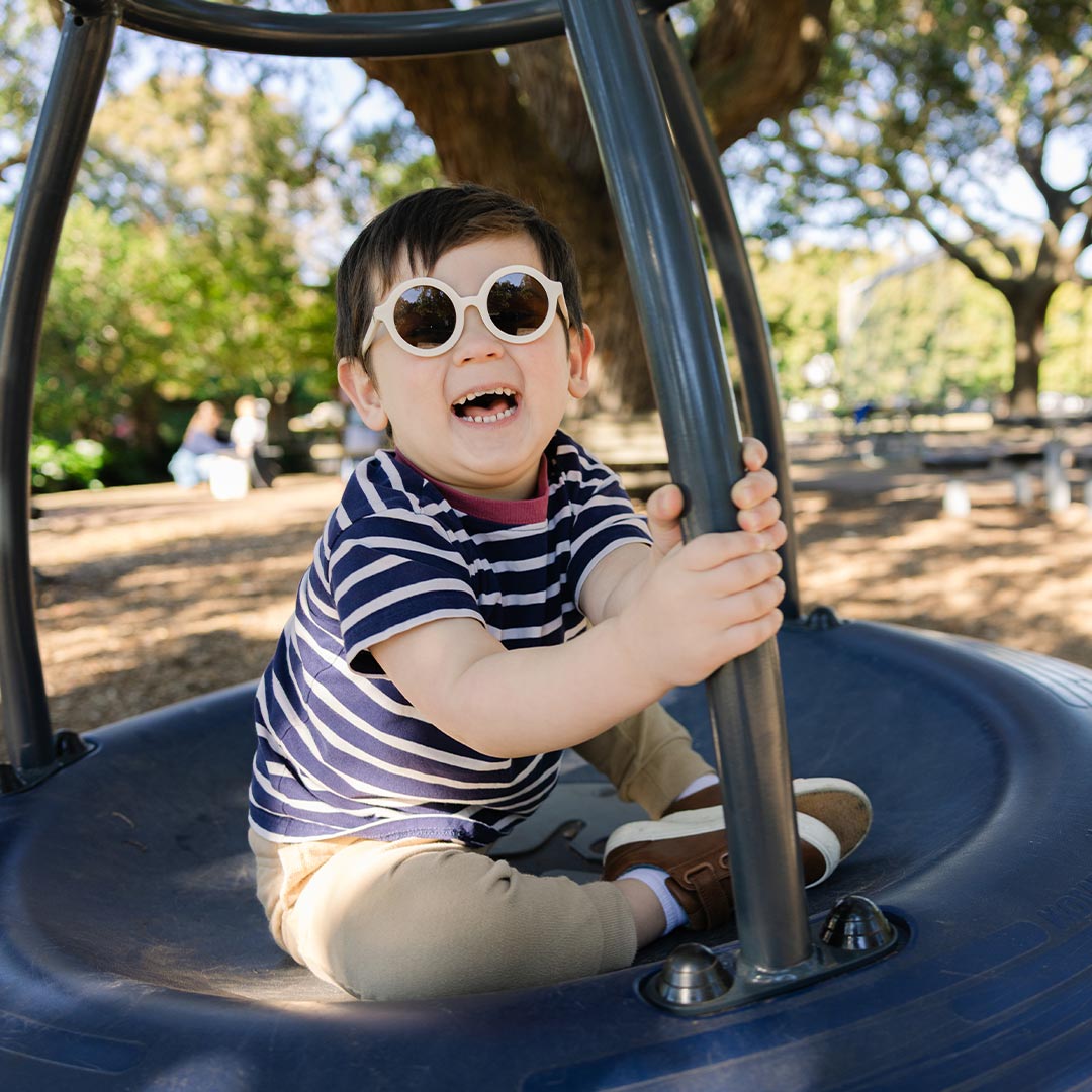 Babiators Original Euro Round Sweet Cream kids sunglasses worn outdoors