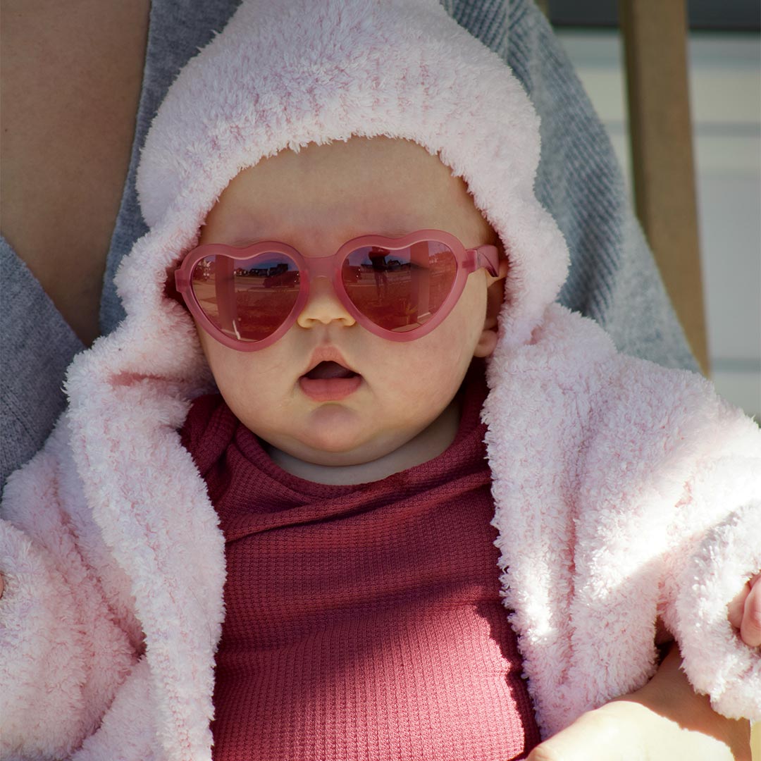 Babiators Original Mirrored Heart Fuchsia Haze kids sunglasses worn outdoors