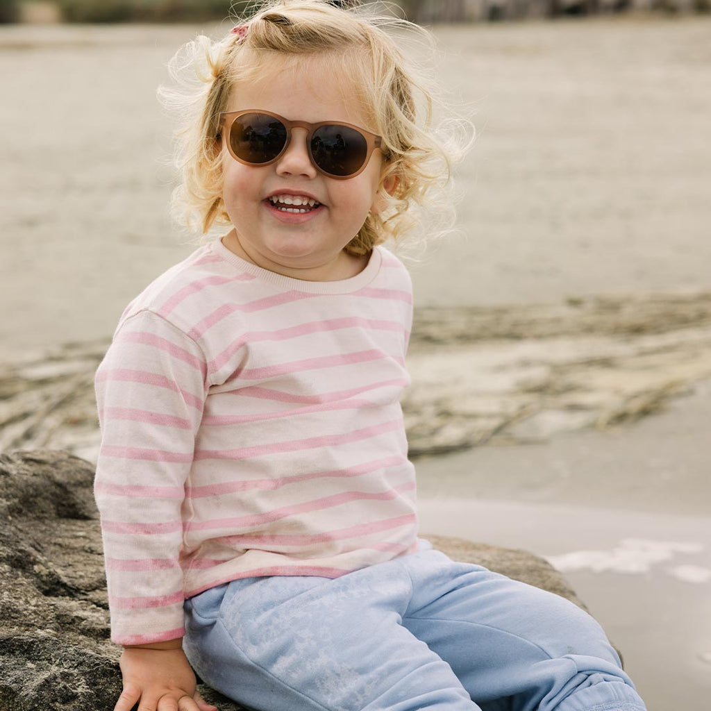 Babiators Original Keyhole Cocoa Cloud kids sunglasses worn outdoors