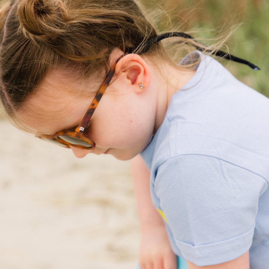 Babiators Original Keyhole Totally Tortoise kids sunglasses worn outdoors