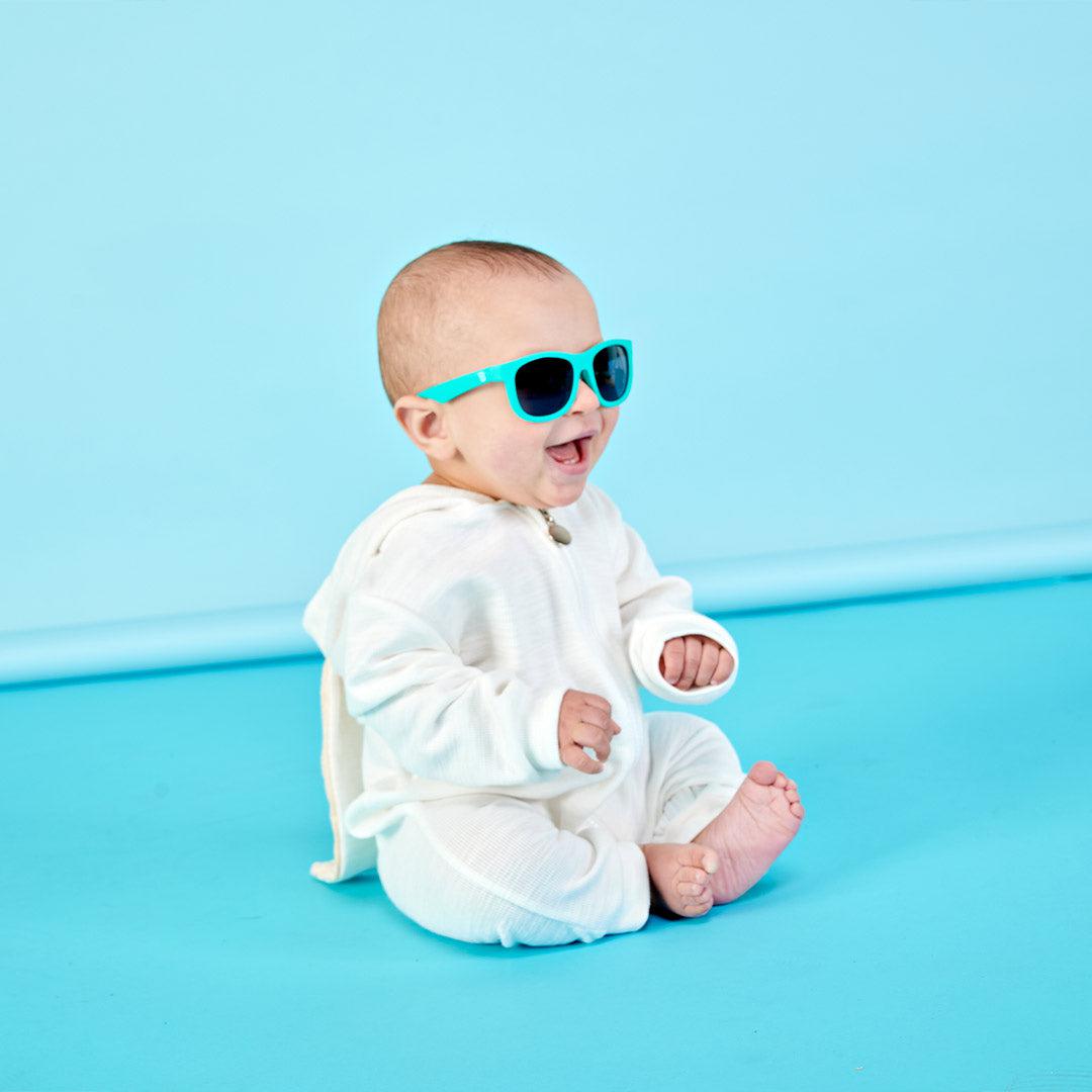 Babiators Original Navigator Totally Turquoise kids sunglasses worn outdoors