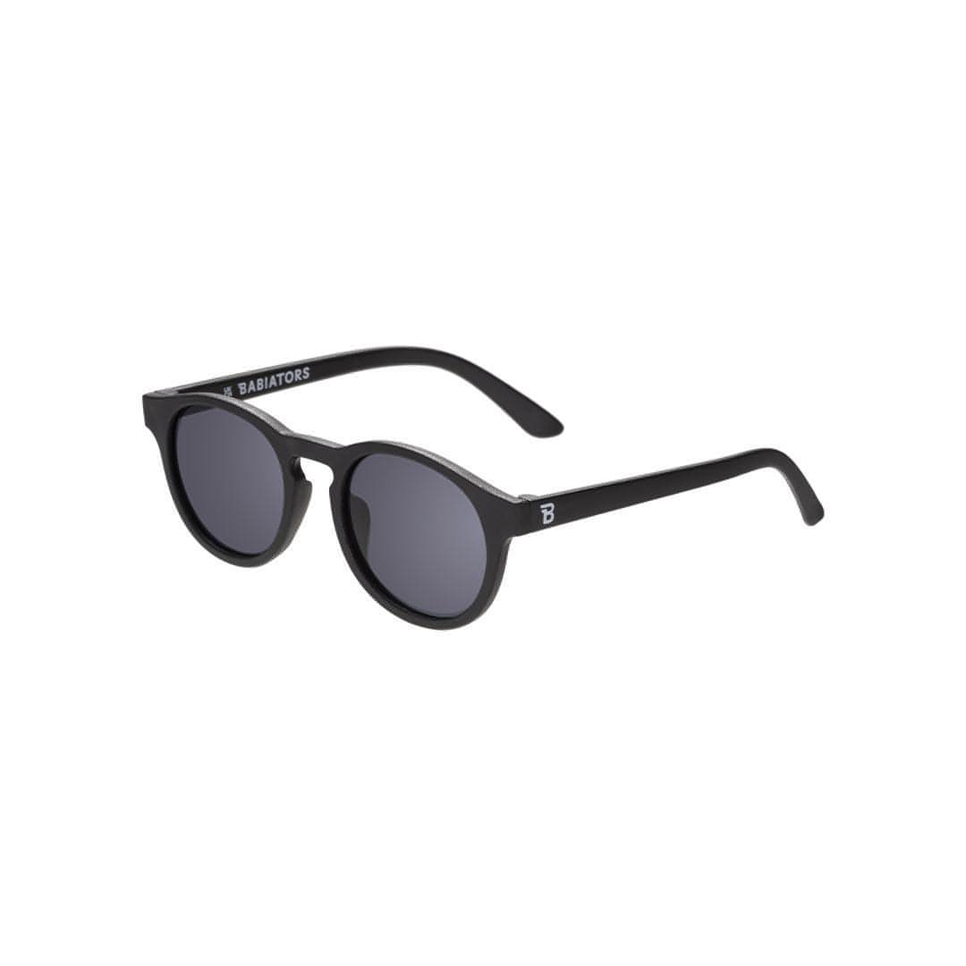 Babiators Original Keyhole kids sunglasses in Jet Black 0-2 years flat lay