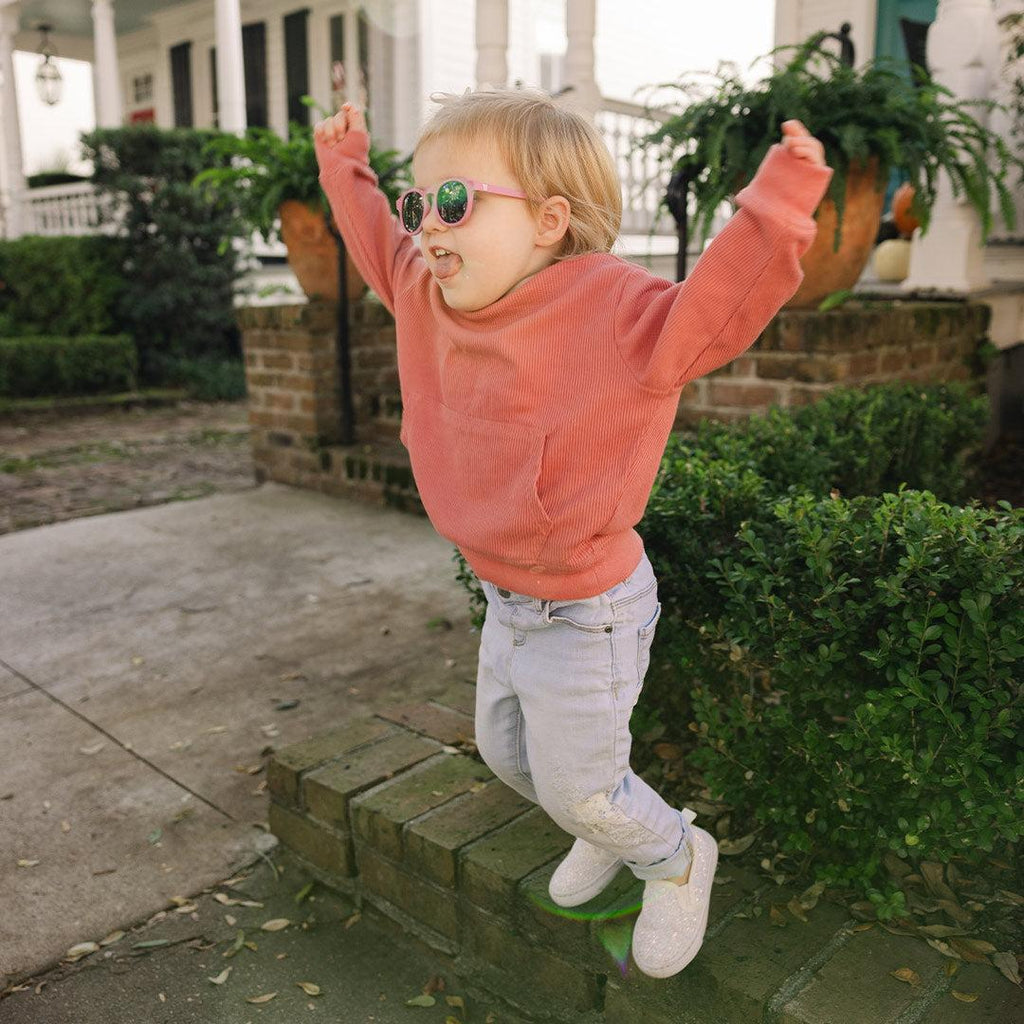 Babiators Original Keyhole Moon Cherry kids sunglasses worn outdoors