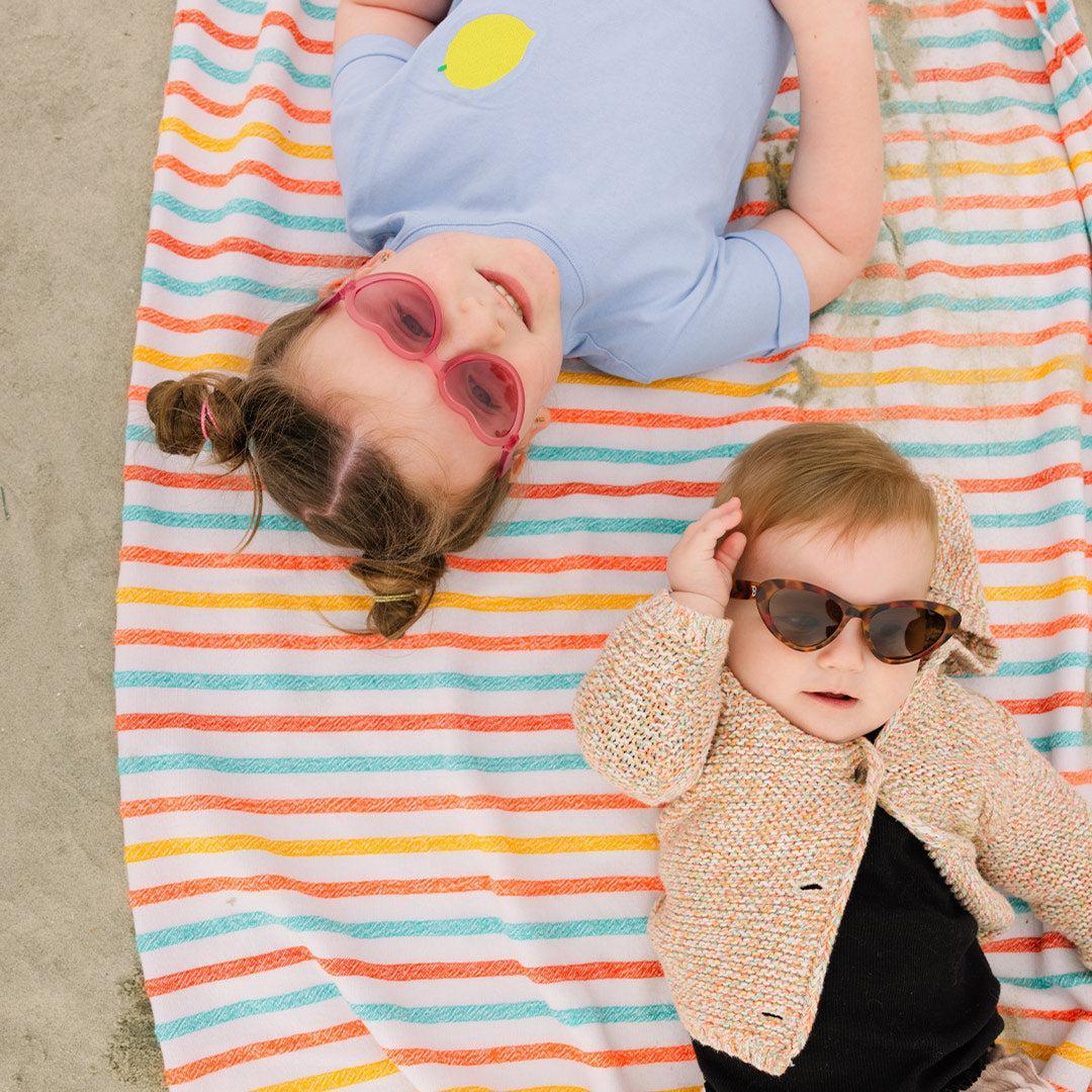 Babiators Original Mirrored Heart Fuchsia Haze sunglasses close-up lifestyle image
