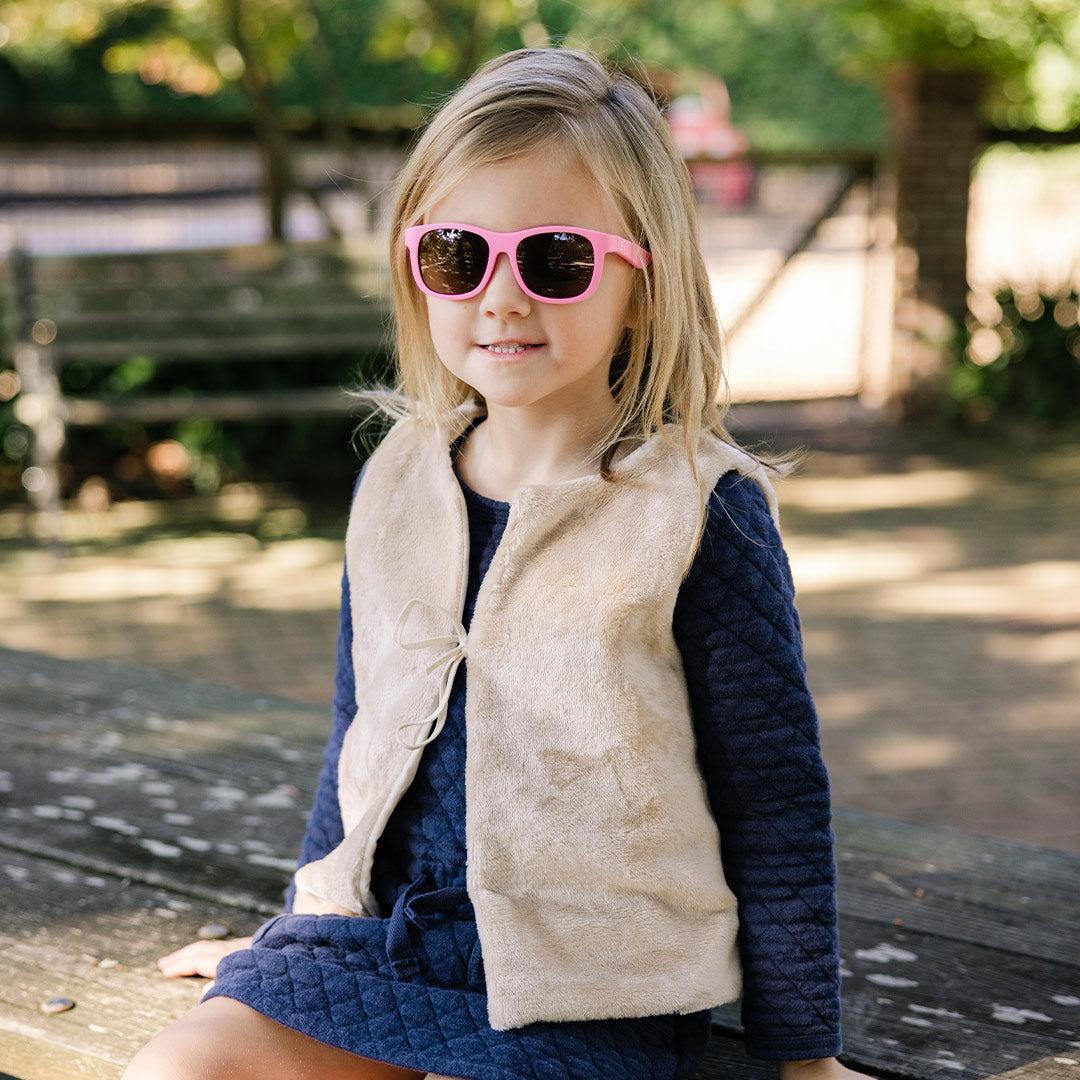 Babiators Original Navigator Candy Pink kids sunglasses worn outdoors