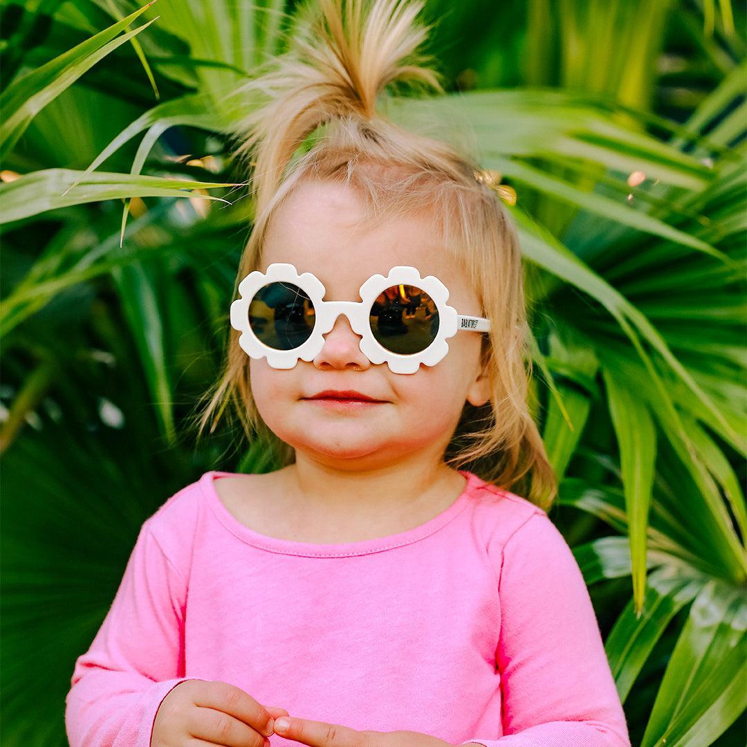 Babiators Polarised Flower Daisy kids sunglasses worn outdoors