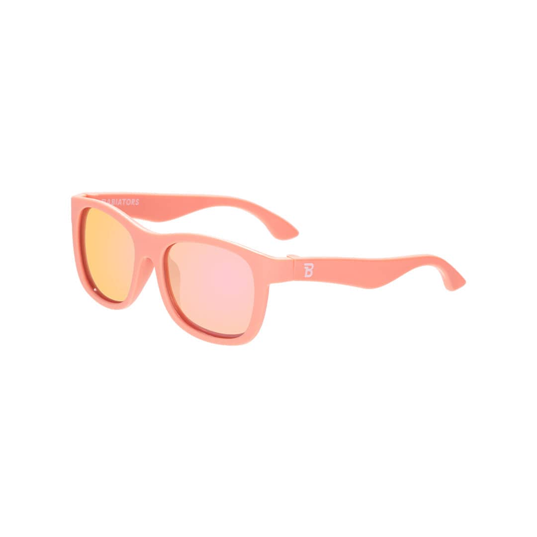 Babiators Polarised Navigator kids sunglasses in Perfectly Papaya 0-2 years flat lay