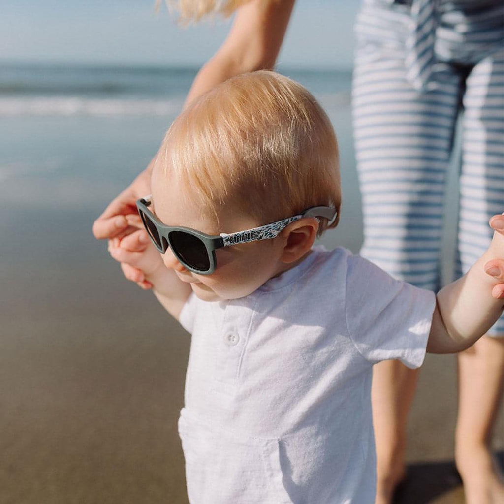 Babiators light grey silicone sunglasses strap attached to children’s sunglasses