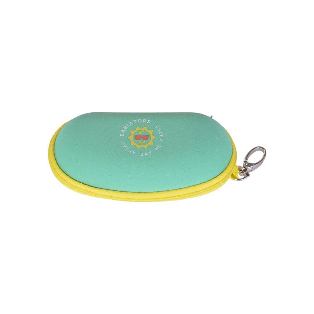 Babiators Aqua with Yellow Trim kids sunglasses travel case flat lay