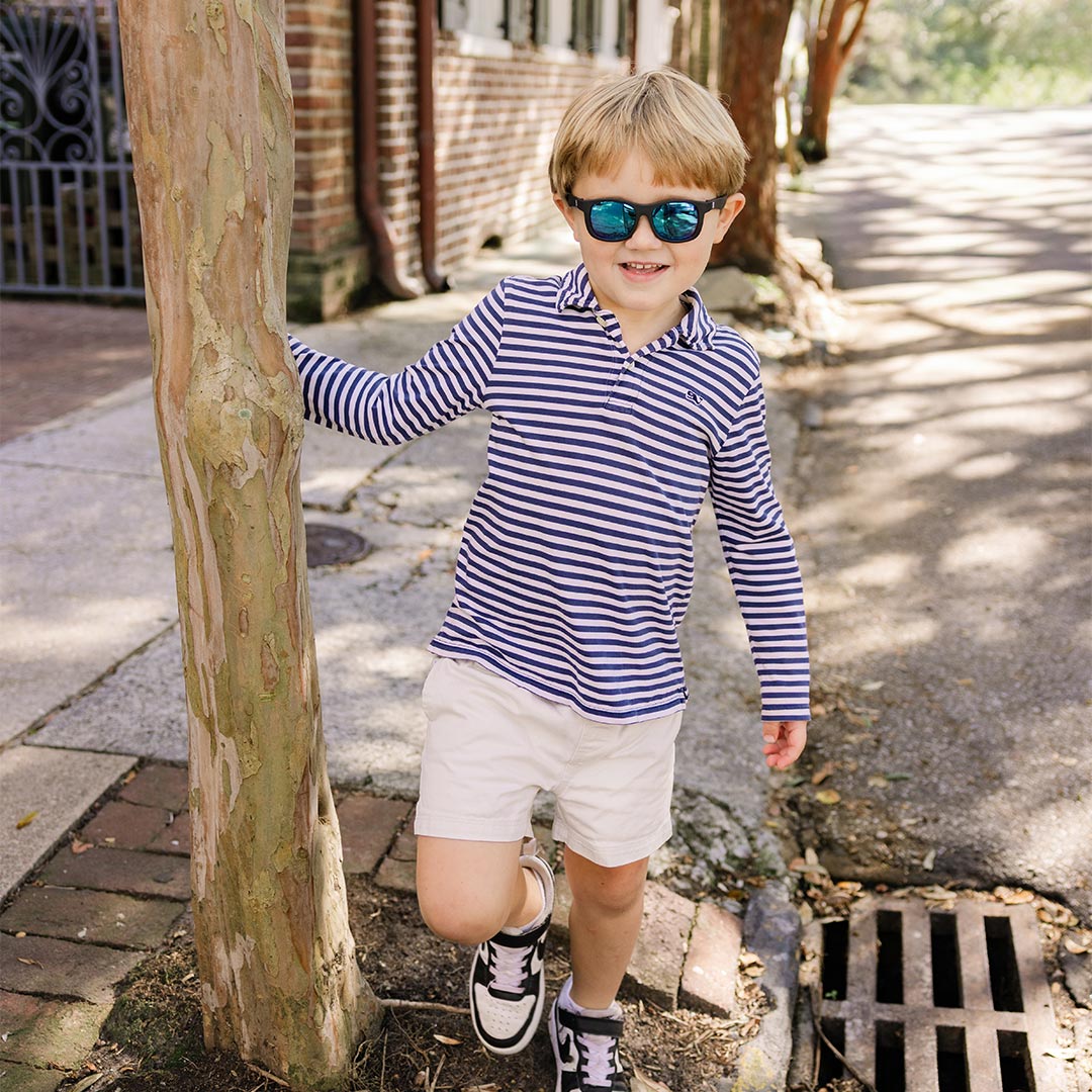 Babiators Polarised Navigator Jet Black kids sunglasses worn outdoors