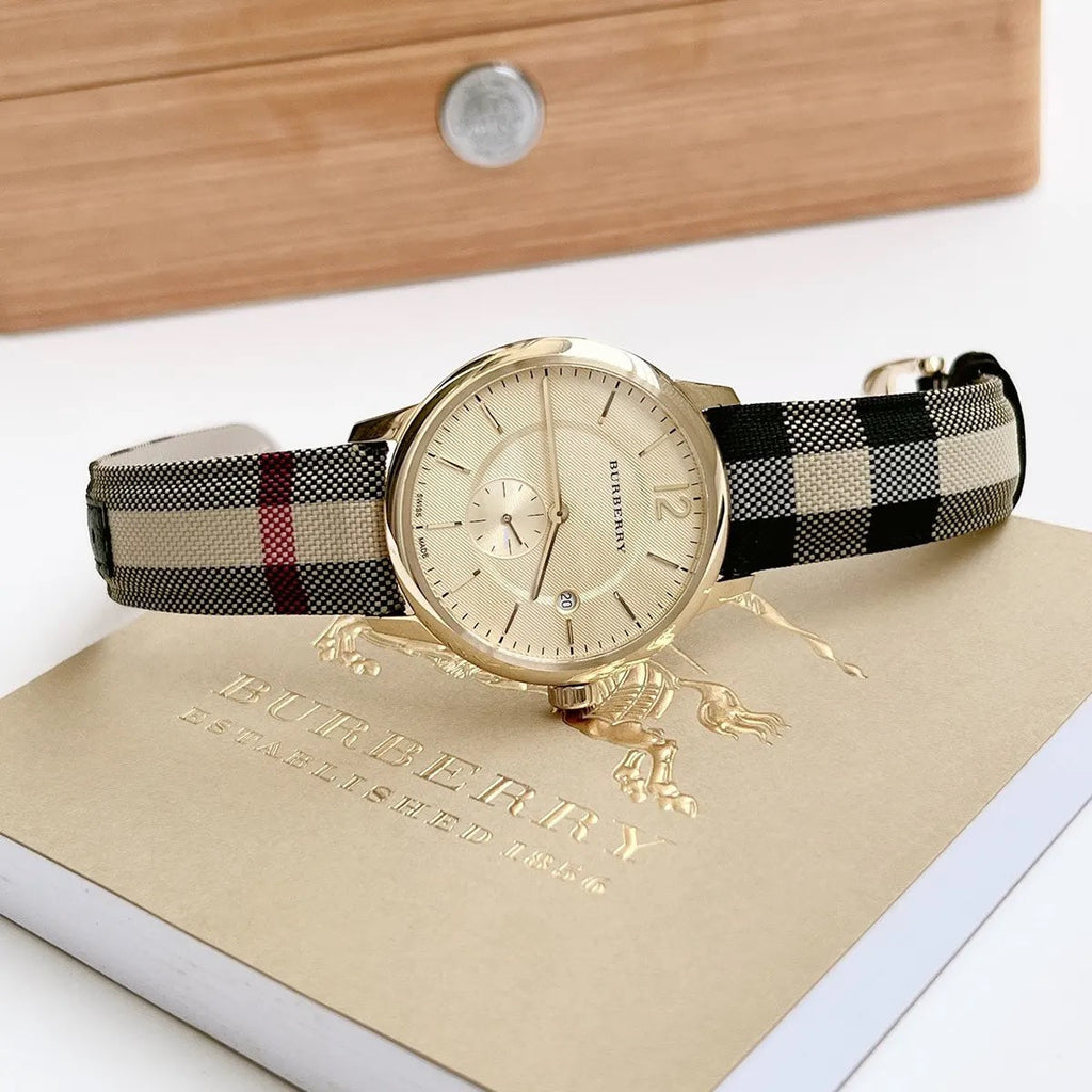 Burberry BU10001 gold dial close-up with multicolour strap